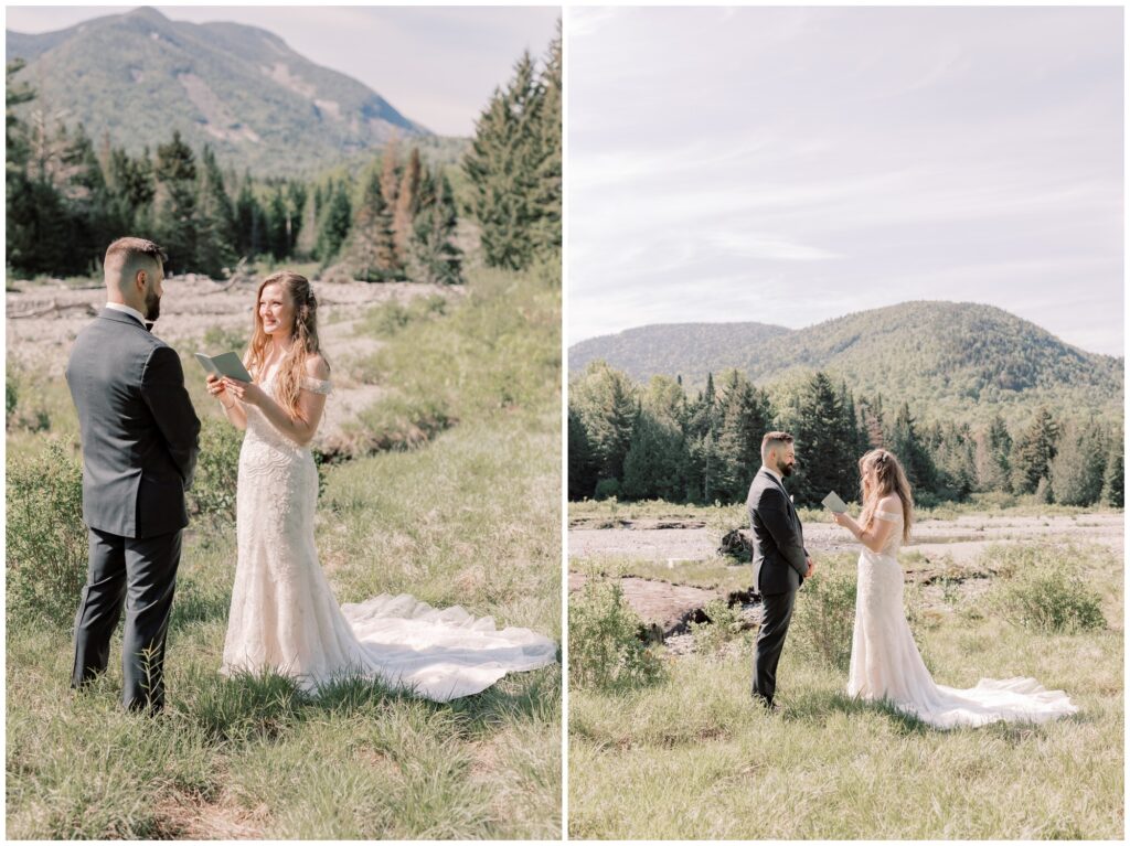 Couple reading their private vows in the valley of mountains during their hiking adventure elopement in the Adirondacks.

