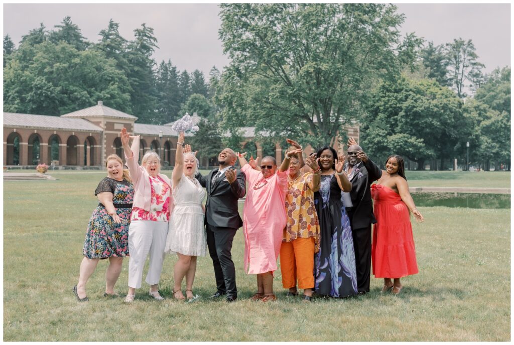 Intimate celebration at Saratoga State Park after an elopement in front of the Lincoln Baths by The Hall of Springs in Upstate New York.