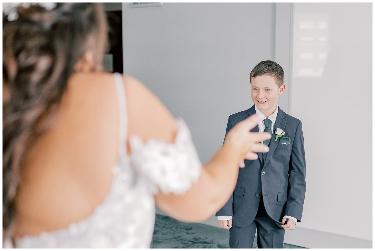 Bride sharing a first look with her son on her wedding day. The wedding was held at The State Room in Albany, NY.