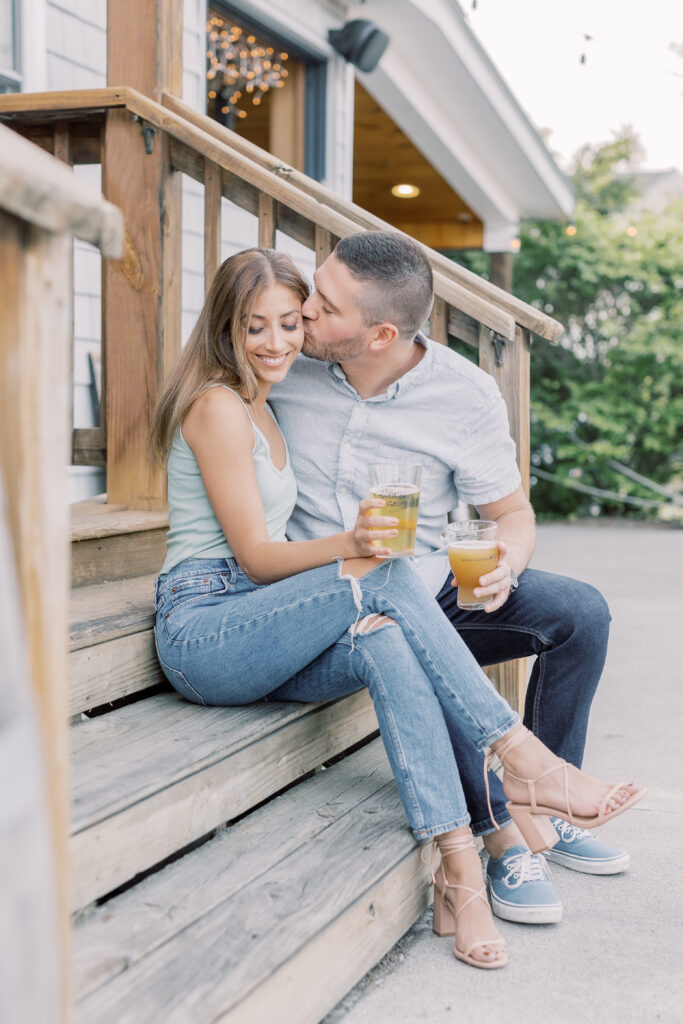 bride and groom casually dressed, enjoying a beer in a brewery in the Adirondacks