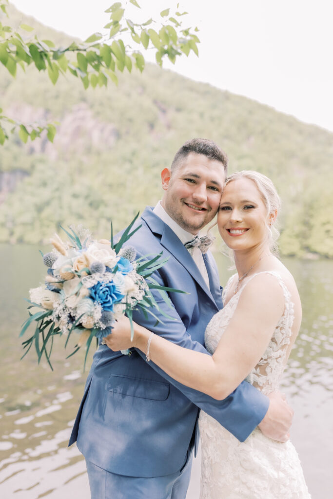 romantic bride and groom portrait surrounded by lush greenery for their Lake George elopement in the Adirondacks