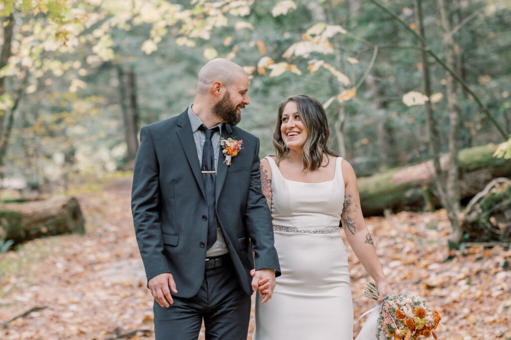 romantic bride and groom portrait in the forest in adirondacks in the fall