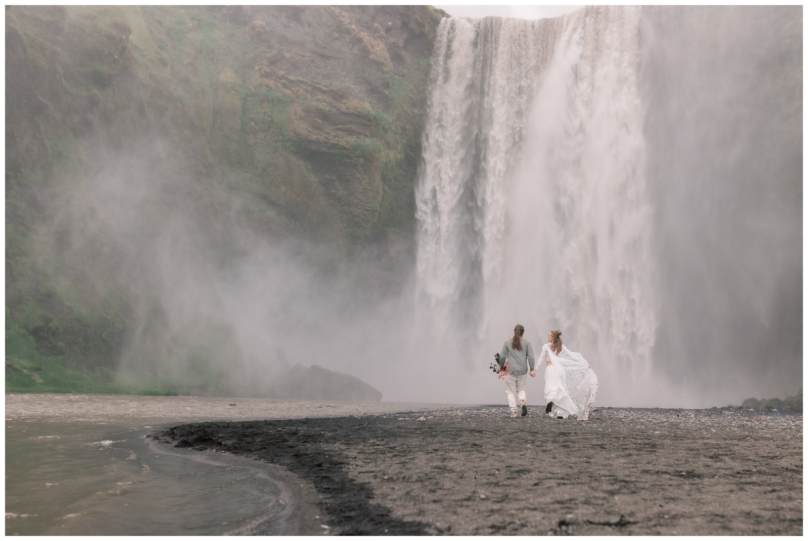 Skogafoss is a popular tourist location in Iceland but still makes a great place to stop for bride and groom portraits during your elopement.