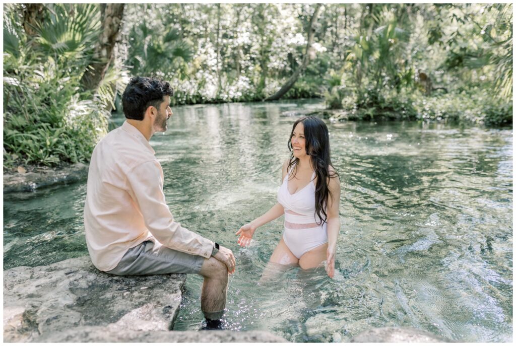 A couple swimming in the springs at Kelly Park.