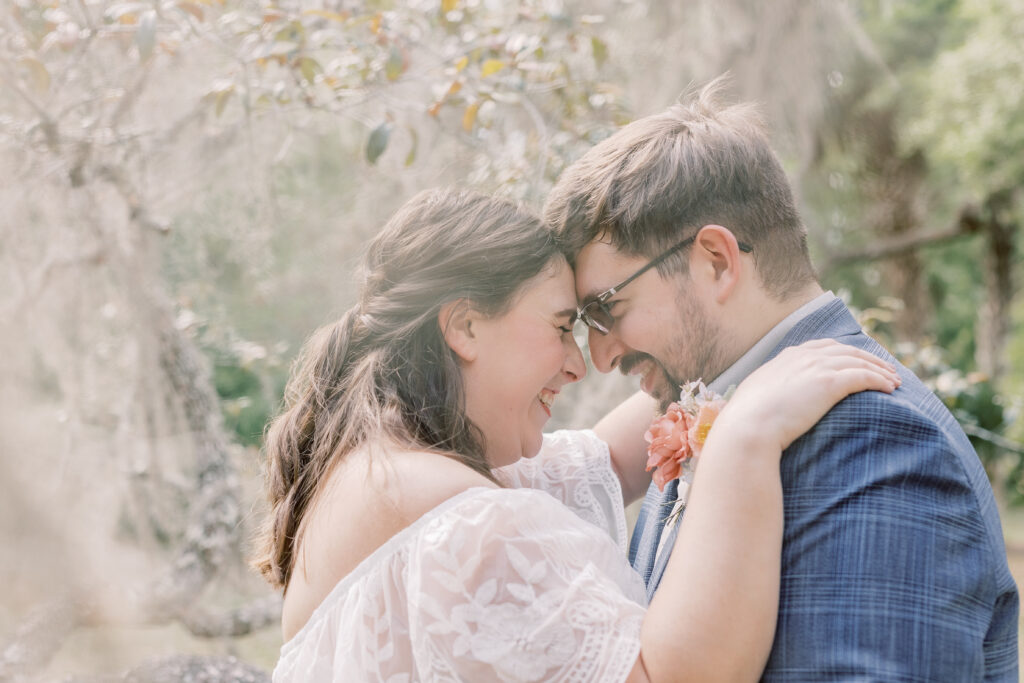 bride and groom touching foreheads