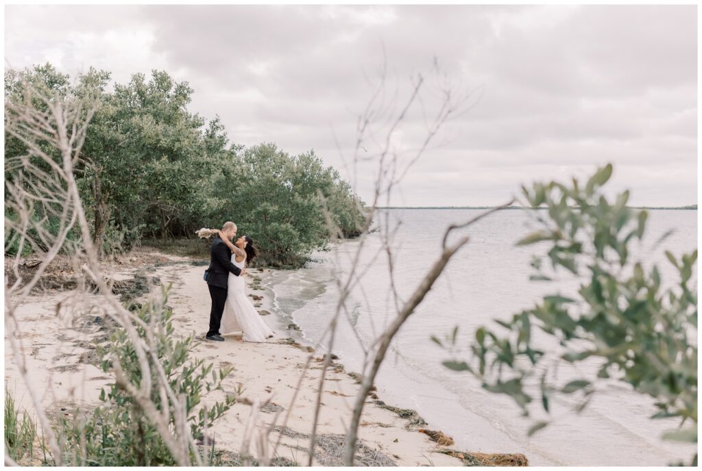 A husband and wife looking at each other after they got married during their Crystal River Elopement.
