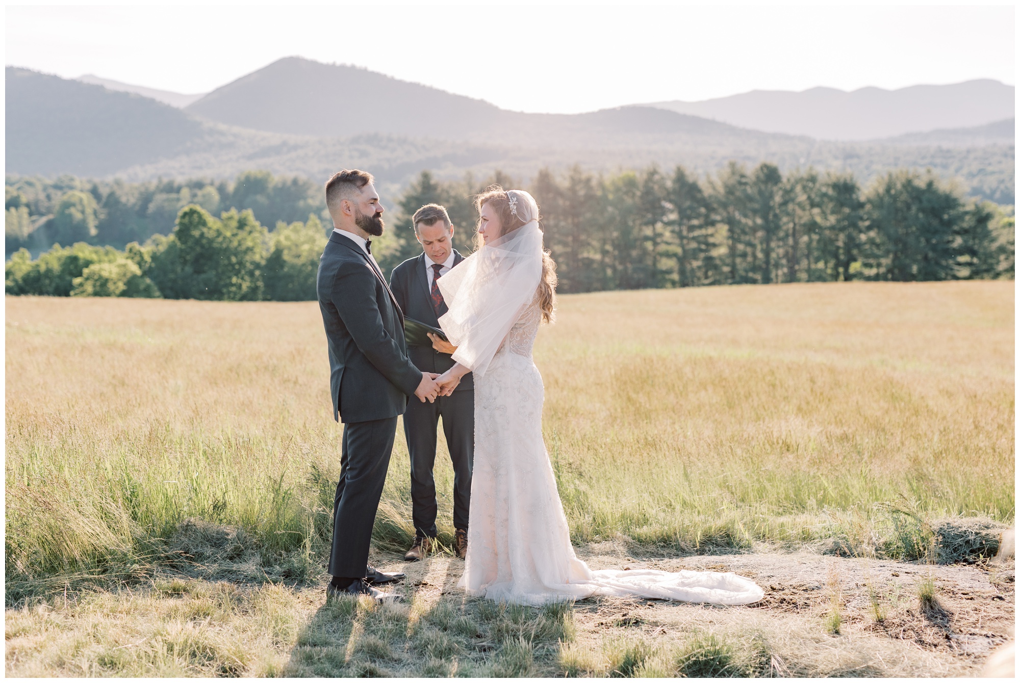 Micro wedding showing a bride and groom holding hands during their outdoor ceremony.
