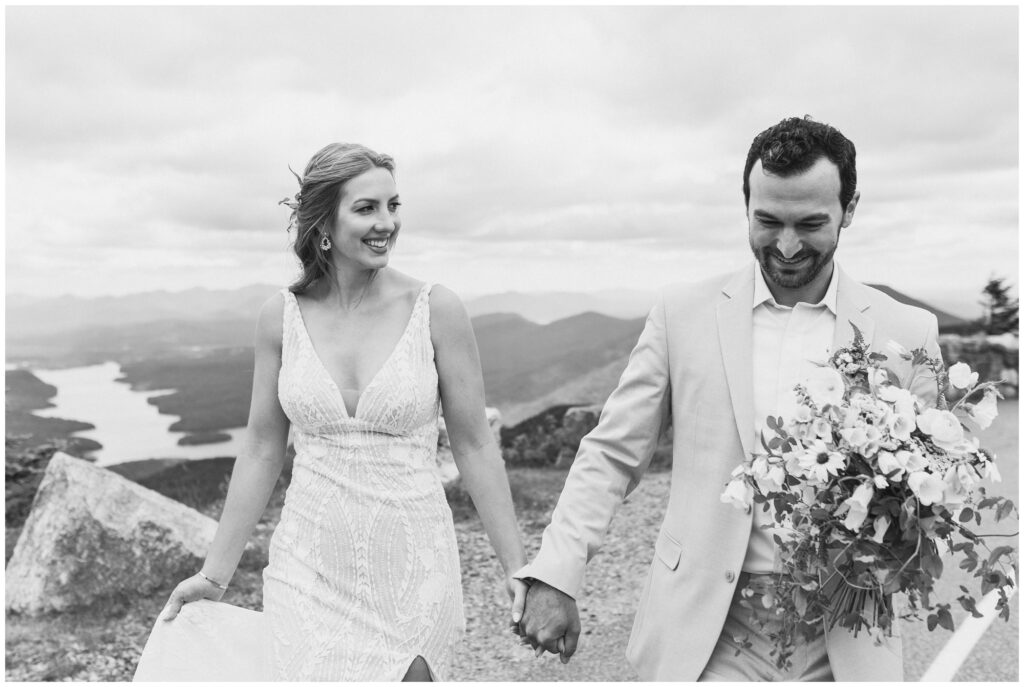 Candid wedding photos at the top of Whiteface in Lake Placid, NY.
