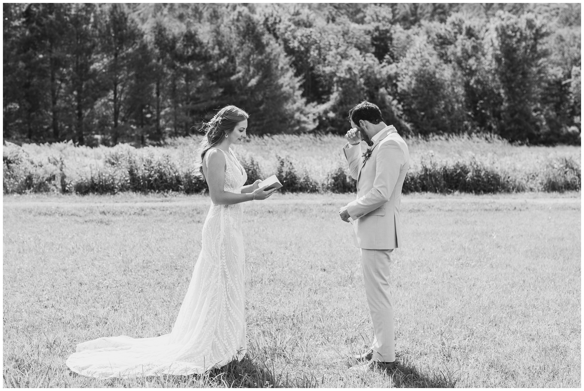 Groom wiping tears away as his bride says her vows.
