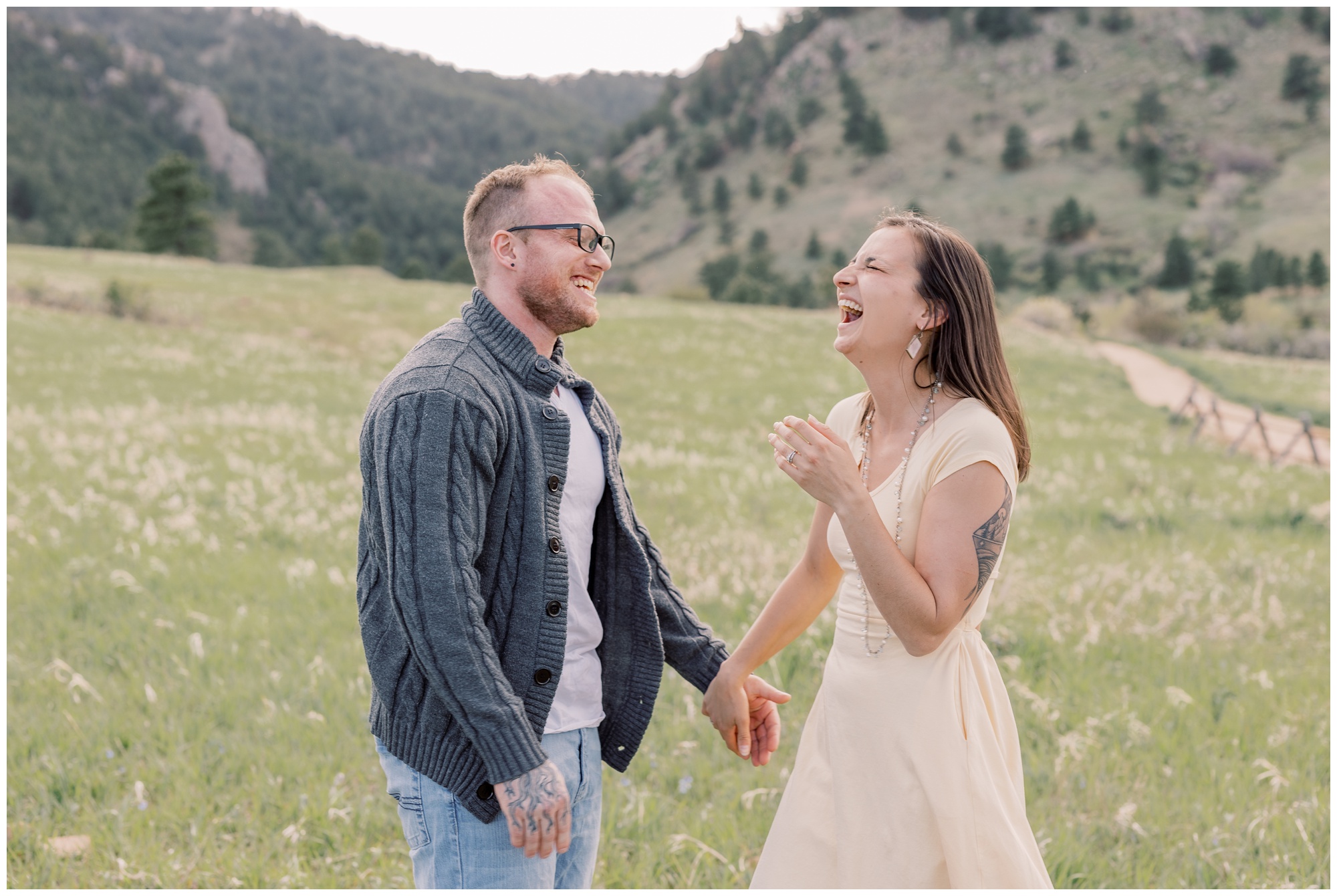 Candid photo of couple at the Flatirons during their Boulder Anniversary Session.
