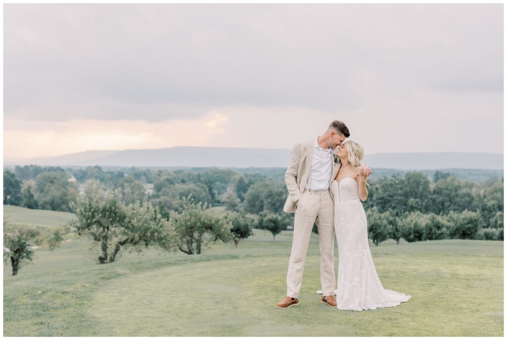 Bride and Groom resting their foreheads together on top of a mountain in the Catskills.
