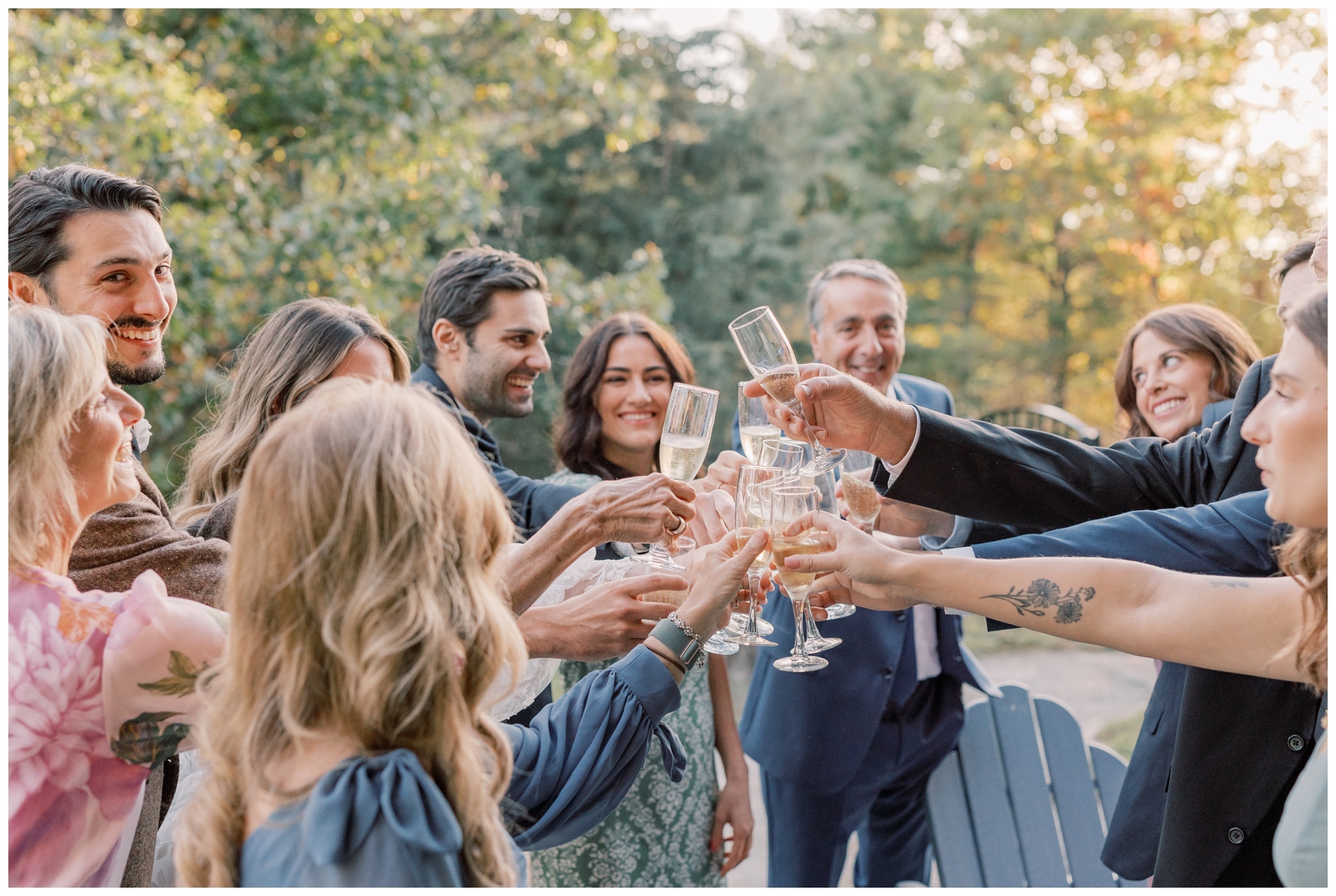 Family members toasting to the bride and groom with champagne.