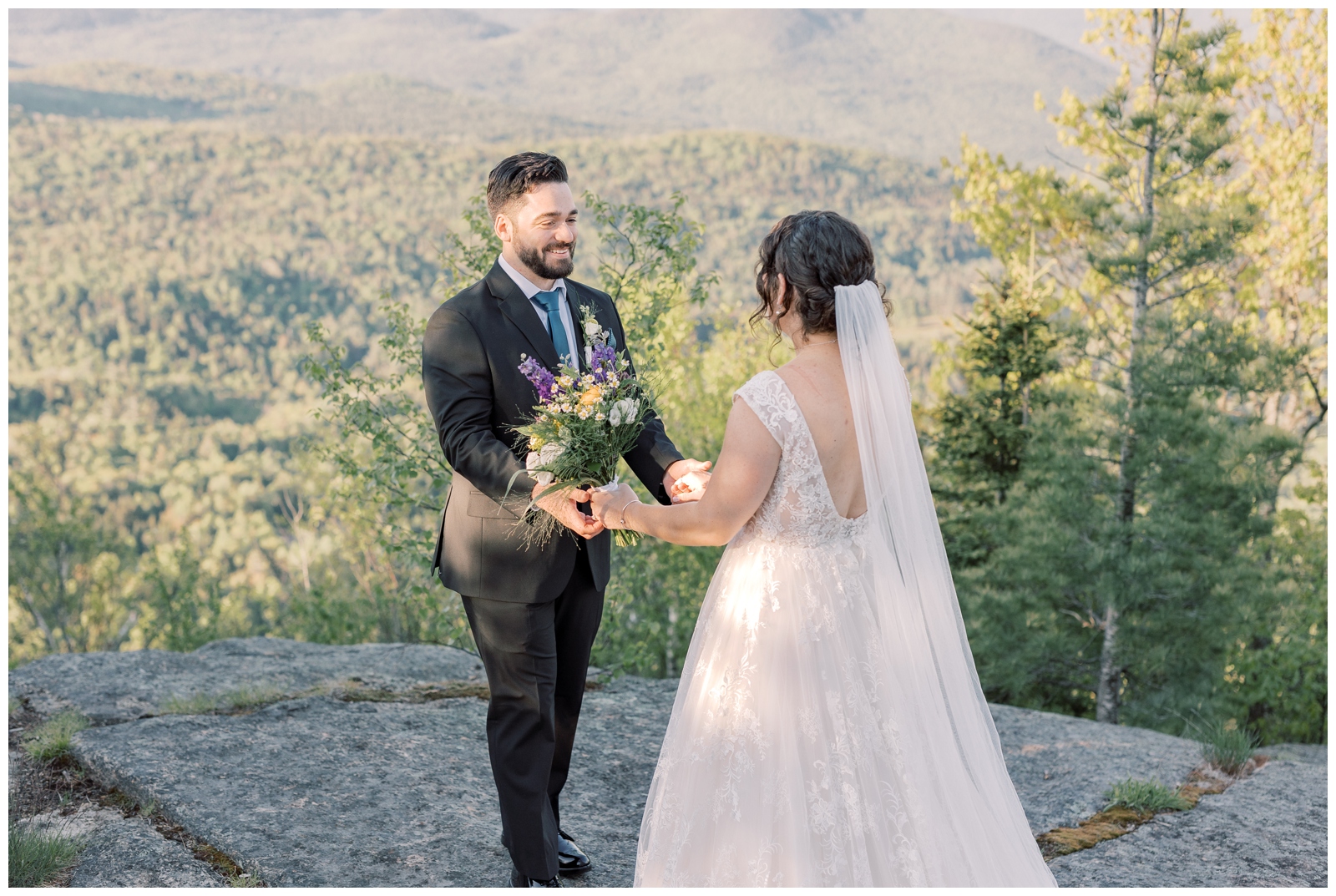 Groom looking at his bride for the first time during their mountain elopement in the Adirondacks.
