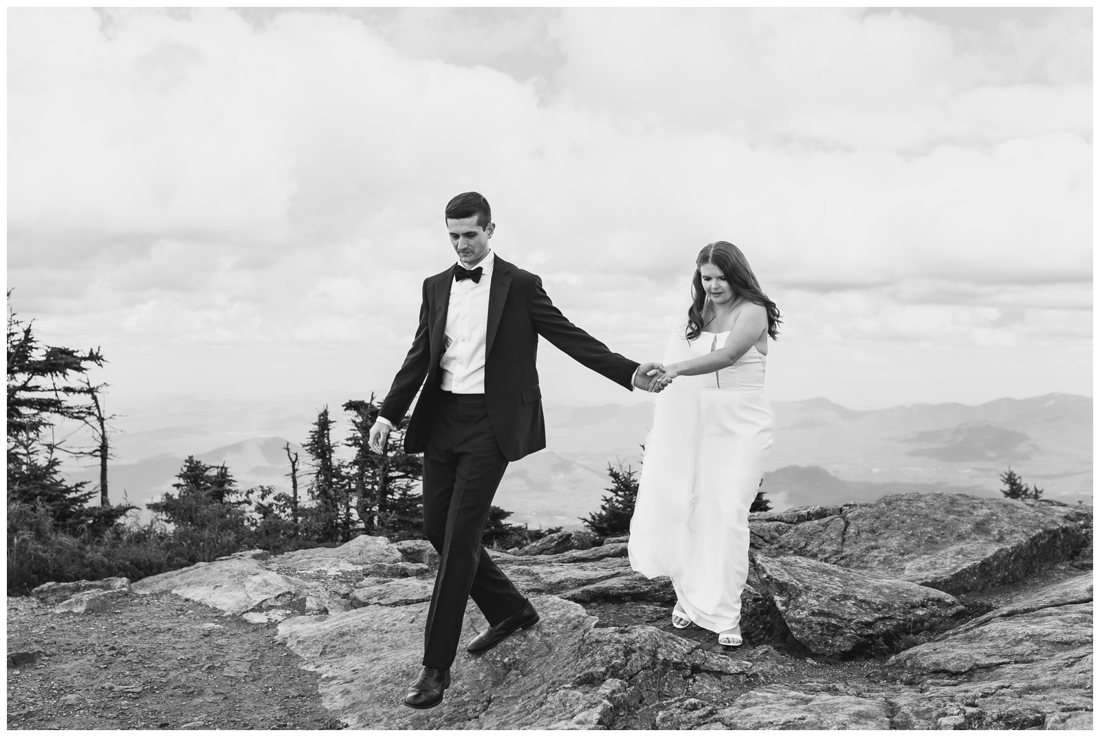 Bride and Groom hiking together in the Adirondacks celebrating their intimate wedding at Whiteface.