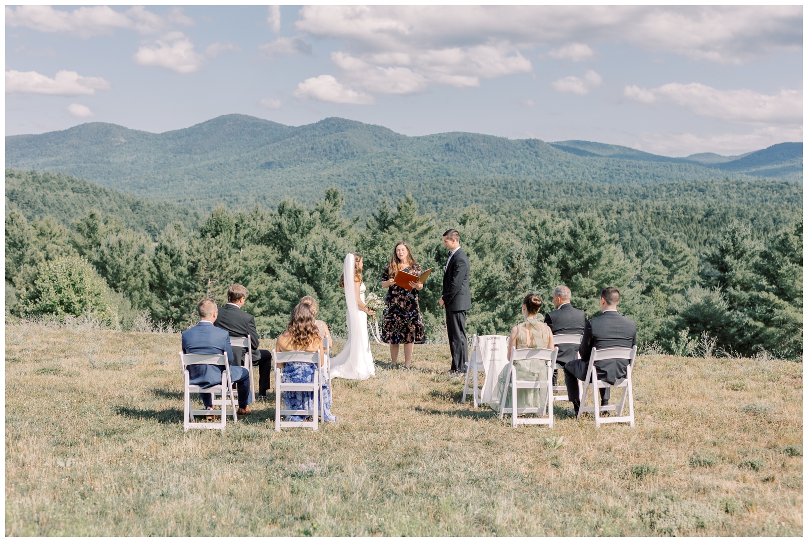 Intimate Lake Placid elopement ceremony at Whispering Pines Airbnb with mountain backdrop.