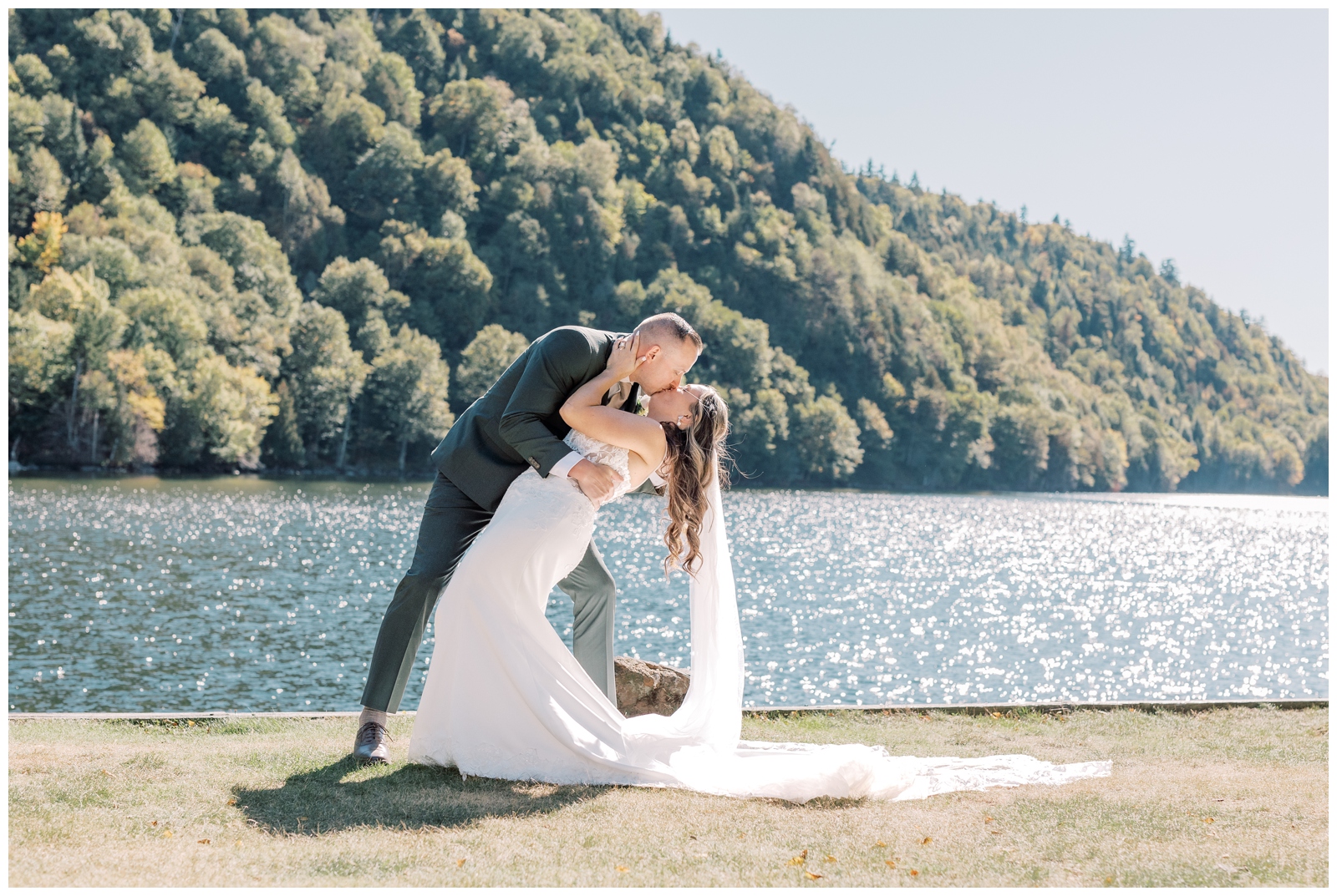 Couple kissing on their wedding day at Cascade Lakes in Lake Placid, NY. Captured by Nicole Weeks Photography, an Adirondack elopement photographer.