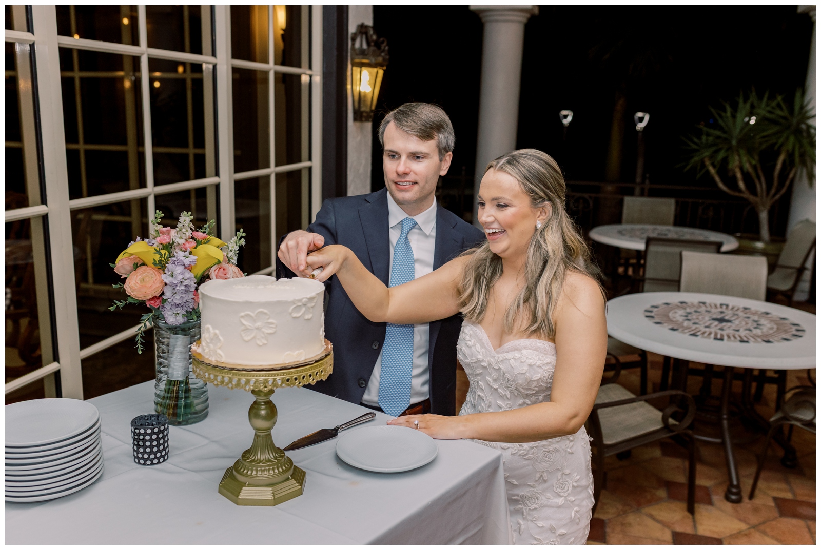 Bride and groom cutting their elopement cake in Florida.